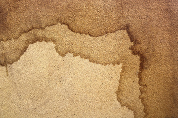 wet marks of moisture in layers on a wooden board surface or an old paper