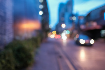 Blurred defocused lights of heavy traffic. Abstract blur image of night light bokeh on street. Blur traffic road with colorful bokeh light. Copy space of  transportation and travel concept.
