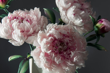 Vase with artificial pions on dark background
