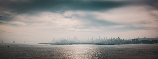 San Francisco skyline through the haze on a sunny day