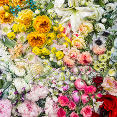 Floral background. Lot of  Decoration artificial flowers in colorful composition