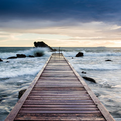 wooden pier at sunset