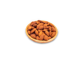 almonds in wooden plate on white background.