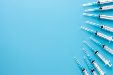 syringes on blue screen background