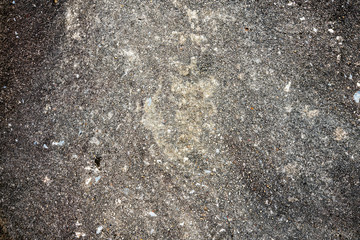 texture of gray asphalt with a touch of ice and frost. small stones and inclusions. vignette