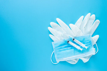 Surgical gloves with  Syringes blue background