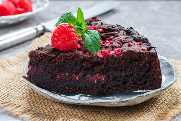 Chocolate and raspberry torte garnished with fresh fruit and mint