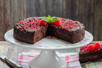 Chocolate and raspberry torte garnished with fresh fruit and mint