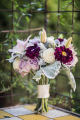 wedding bouquet with muted colors and unique flowers