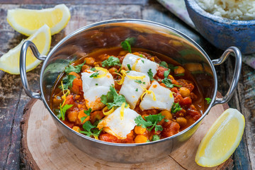 Curried cod with chickpeas, fresh coriander and rice