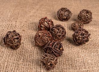 Decorative twigs of wooden on coarse canvas.