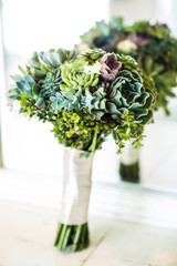 wedding bouquet with a variety of green succulents