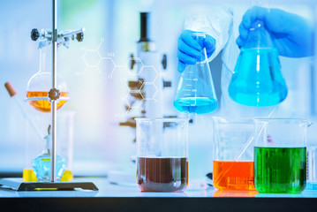 Image LAB  of Coronavirus covid-19 sample test with microscope by biochemical team  and  blood sample test in pharmaceutical research laboratory for vaccine  to protect coronavirus covid-19 spreading.