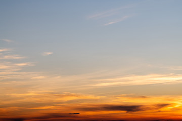 Fototapeta na wymiar Orange horizon and blue atmosphere. Smooth orange blue gradient of dawn sky.
