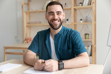 Close up happy bearded man hr makes good first impression for applicant in office. Board smiling male manager introduces company for job seeker at hire meeting.