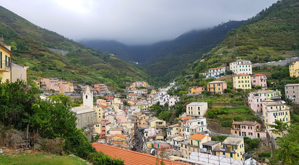 Fototapeta na wymiar Landscape of the village of Riomaggiore in the province of La Spezia, Liguria, Italy. It belongs to the Cinque Terre National Park.