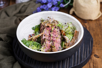 roast beef slices with vegetables and herbs