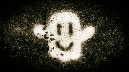Dark image of ghost spray-painted on sidewalk.  Great texture for background image.