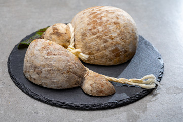 Italian semi hard matured caciocavallo cheese, handmade and aged in natural underground caves in Apulia region