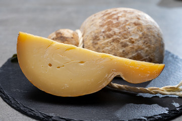 Italian semi hard matured caciocavallo cheese, handmade and aged in natural underground caves in...