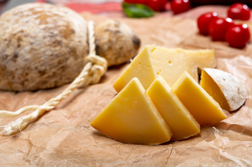 Italian semi hard matured caciocavallo cheese, handmade and aged in natural underground caves in...