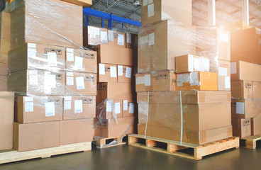 Interior of storage warehouse, stack package boxes on pallets, warehouse industry delivery shipment goods, manufacturing plant shipping logistics and transport