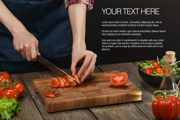Woman cooking fresh healthy salad. Female hands cutting vegetables on board on wooden table with sample text.