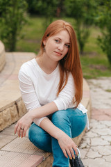 Fototapeta na wymiar Female portrait of a red-haired woman