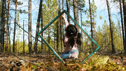 
girl on a photo frame in nature