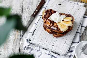 Toast with banana and curd cheese. A simple idea for breakfast.