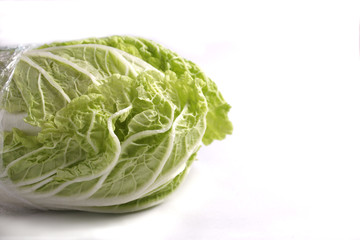 green lettuce on white, isolated, close up shot