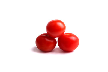 several red tomatoes on the white background, isolated.