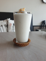 Cool milk slush in a transparent cup.
