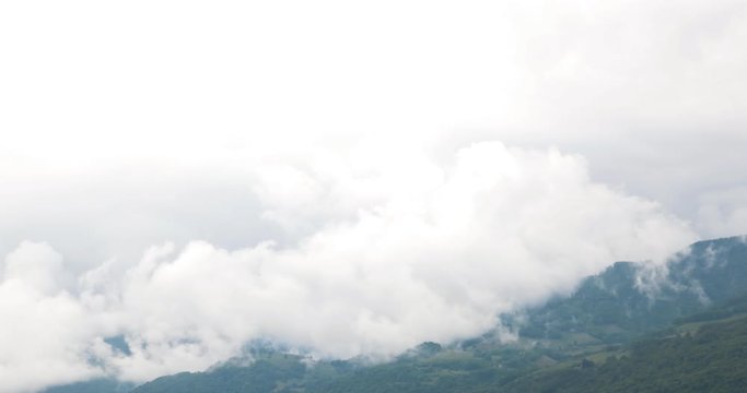 4k timelapse video for clouds forming fast in a vertical way and going upwards the sky over Chamrousse Mountain at Grenoble.