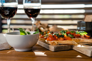 Brushetta set and glass of red wine