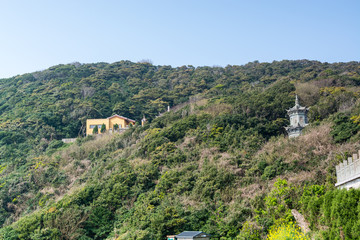 Fototapeta na wymiar Building of Chinese buddhist temple in Mount Luojia, which lies in the Lotus Sea to the southeast of Putuo Mountain, Zhoushan, Zhejiang, the place where Bodhisattva Guanyin practiced Buddhism