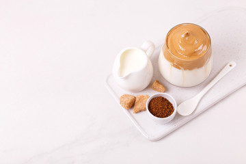 whipped dalgona coffee with milk and cane sugar. South Korean summer drink