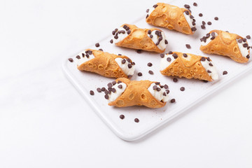 Sicilian dessert cannoli with chocolate
