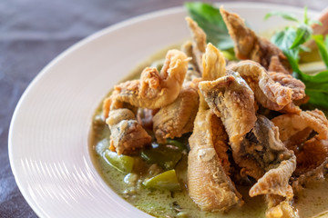 Green curry with chicken and crispy fried fish skin