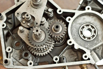 Disassembled engine from a motorcycle close up. Repair and maintenance of old spare parts.