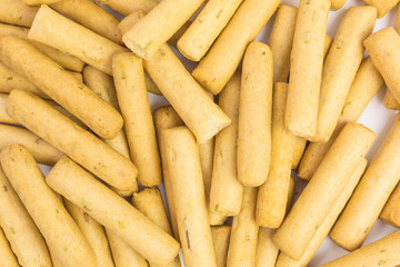 background of mediterranean mini grissini bread sticks with rosemary