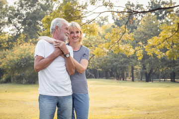 Happy smiling of senior couple in a park on a holiday.