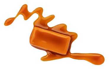 Obraz premium Caramel sauce flowing on caramel candies, isolated on white background. Golden Butterscotch toffee candy.