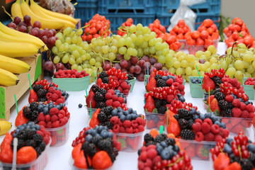 Bright fresh berries and fruits on the market