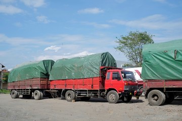 Cargo trucks are parked in the rest area on a goods delivery mission