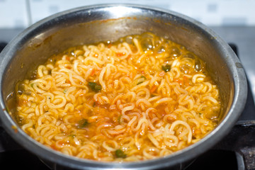 Cook Famous home made asian instant noodle in a porcelain bowl . Close up