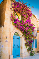 Mdina Malta Flower Building with azure door and round window