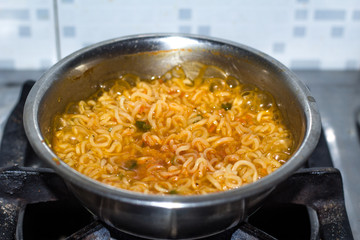 Cook Famous home made asian instant noodle in a porcelain bowl . Close up