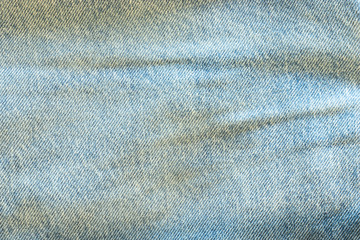 Denim texture macro shot. Blue light jeans background with copy space