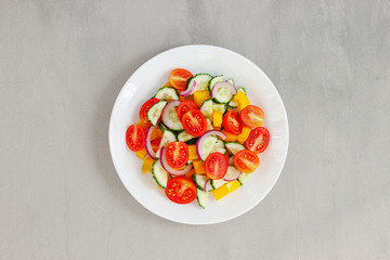 Green salad with tomato and fresh vegetables